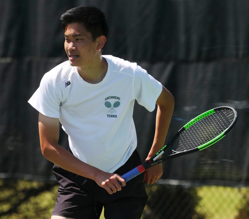 Andy Zhu of Archmere follows through on a return as he beats Sanford's Charlie Sternberg for the title at first singles during the DIAA state tennis championships at St. Andrew's School, Thursday May 25, 2023.