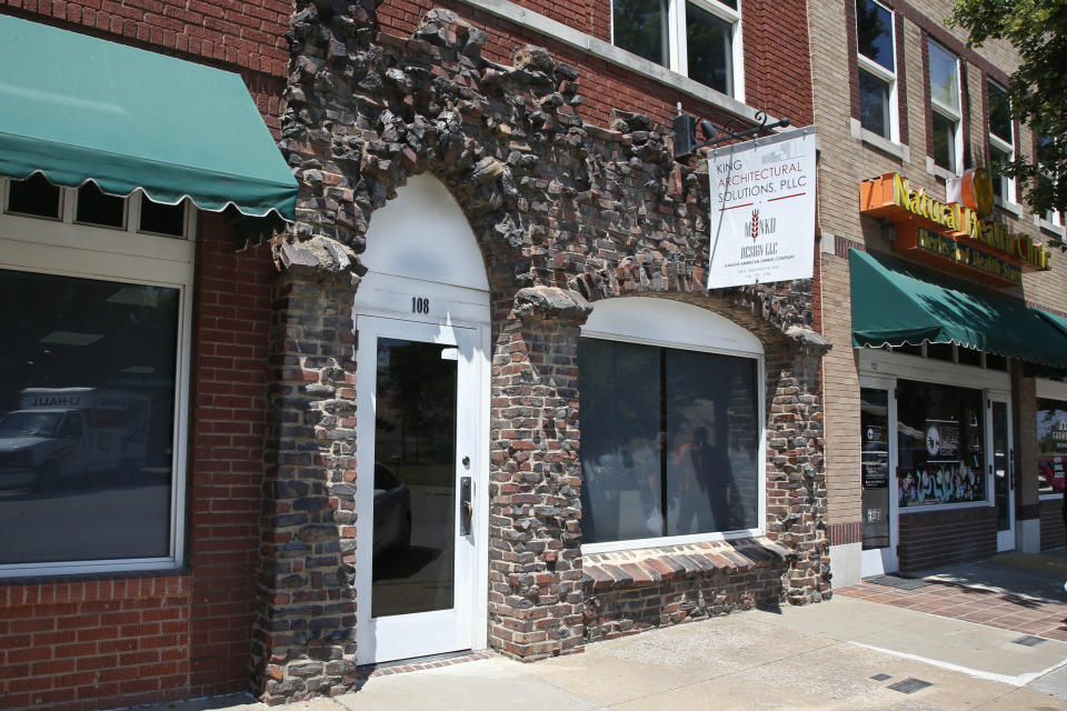 Burned bricks on a modern storefront are one of the few surviving reminders of the more than 30-block historic black district in Tulsa, Okla., Monday, June 15, 2020. (AP Photo/Sue Ogrocki)