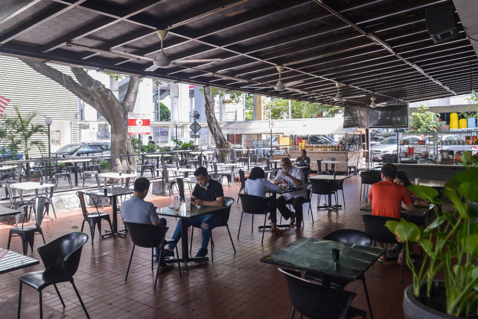 People dine-in at Canai Cafe during Phase One of the National Recovery Plan in SS15, Subang Jaya, August 25,2021. — Picture by Miera Zulyana