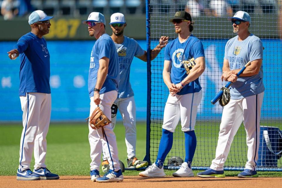 José Alguacil, from left, Royals infield coach, talls to Royals utilityman Nick Loftin, outfielder MJ Melendez, shortstop Bobby Witt Jr. and Royals bench coach Paul Hoover during batting practice before the Royals took on the New York Yankees on Wednesday, June 12, 2024, at Kauffman Stadium.