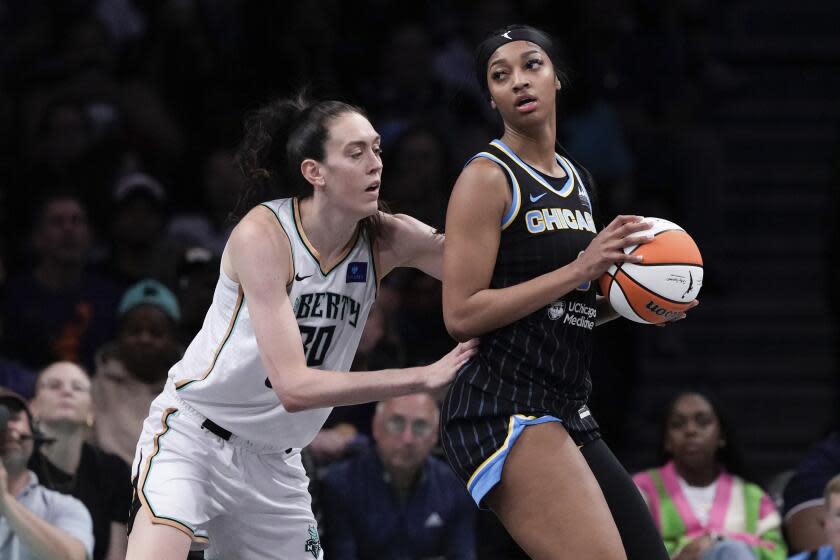 New York Liberty's Breanna Stewart defends against Chicago Sky's Angel Reese