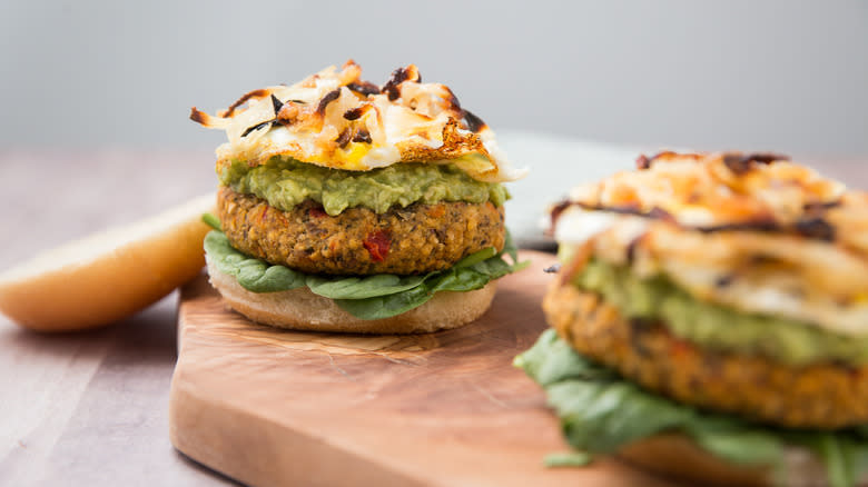 onion-topped veggie burgers on board