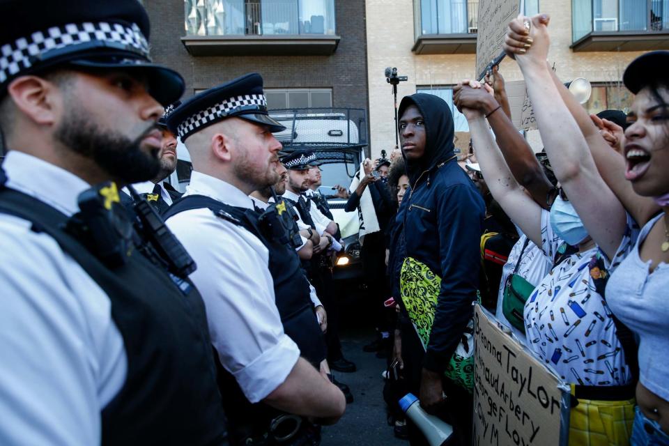 Police block a road close to the US Embassy during a Black Lives Matter march through central London (Getty Images)