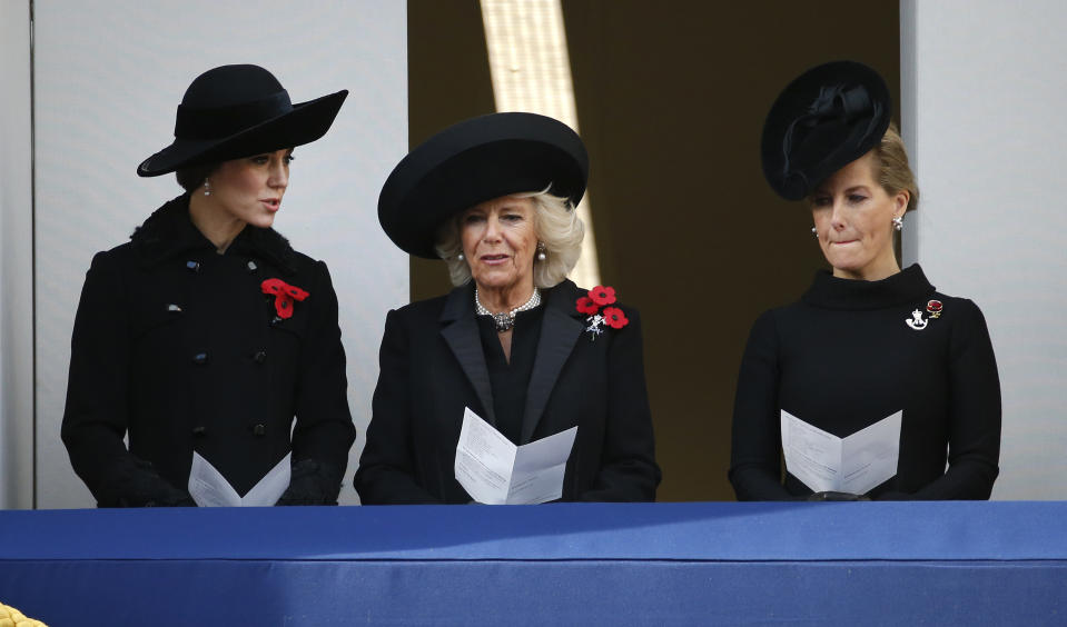 FILE - Kate, Duchess of Cambridge, left, talks to Camilla, Duchess of Cornwall, center, and Sophie, Countess of Wessex as they watch the Remembrance Sunday service at the Cenotaph in London, Sunday, Nov. 13, 2016. Britain's queen consort, Camilla, has come a long way. On May 6, she will be crowned alongside her husband and officially take her first turns on the world stage as Queen Camilla. It’s been a remarkable and painstakingly slow transformation over five decades. (AP Photo/Alastair Grant, File)