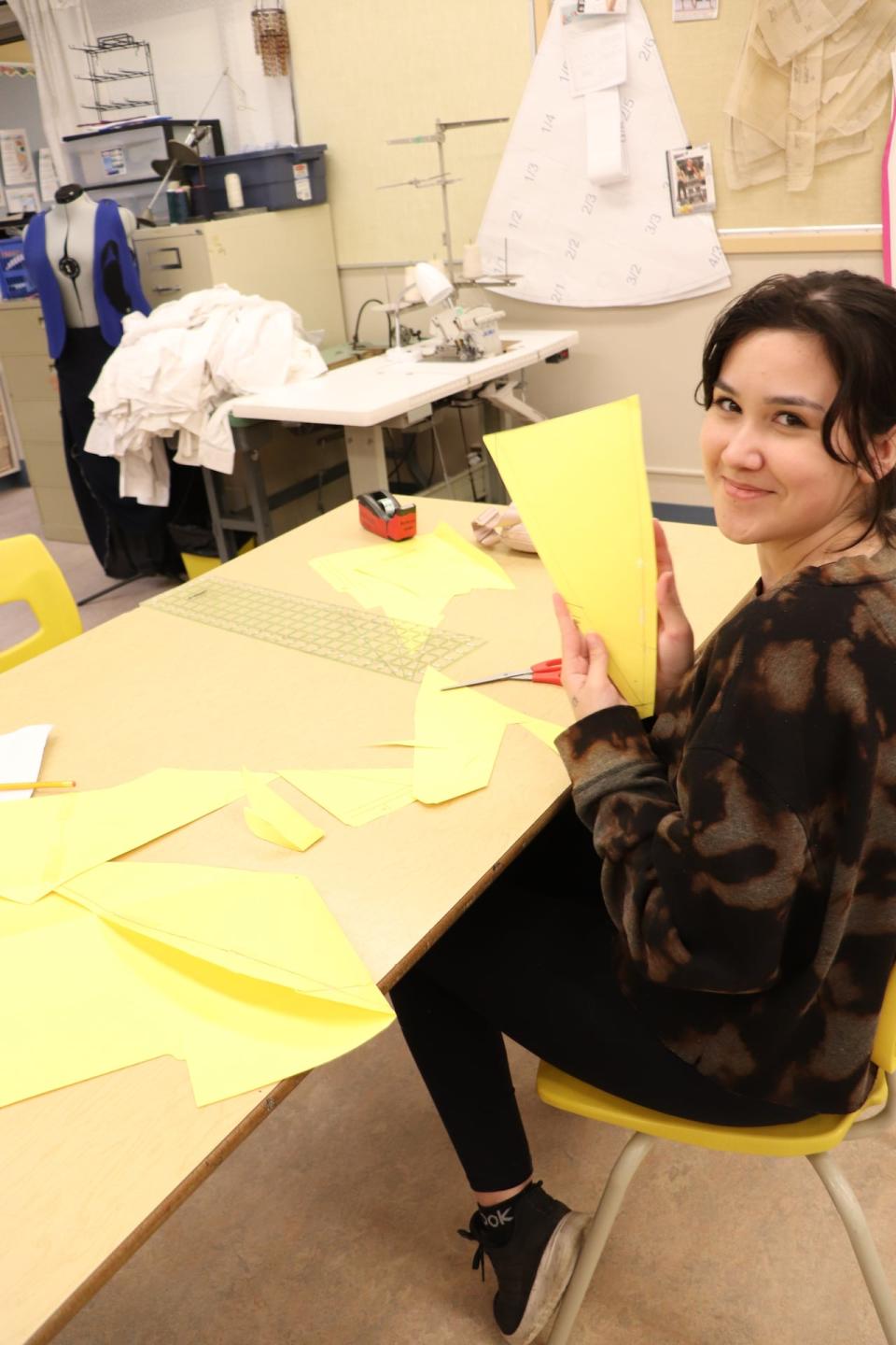 Leandra Blanchard, a graduate from the Individual Learning Centre in Whitehorse, working on regalia for the graduation ceremony.