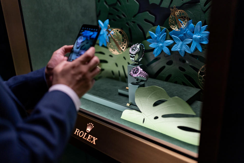 A visitor looks at replica watches at the Rolex stand at the Watches & Wonders exhibition in Geneva, Switzerland, April 9, 2024. REUTERS/Pierre Albouille