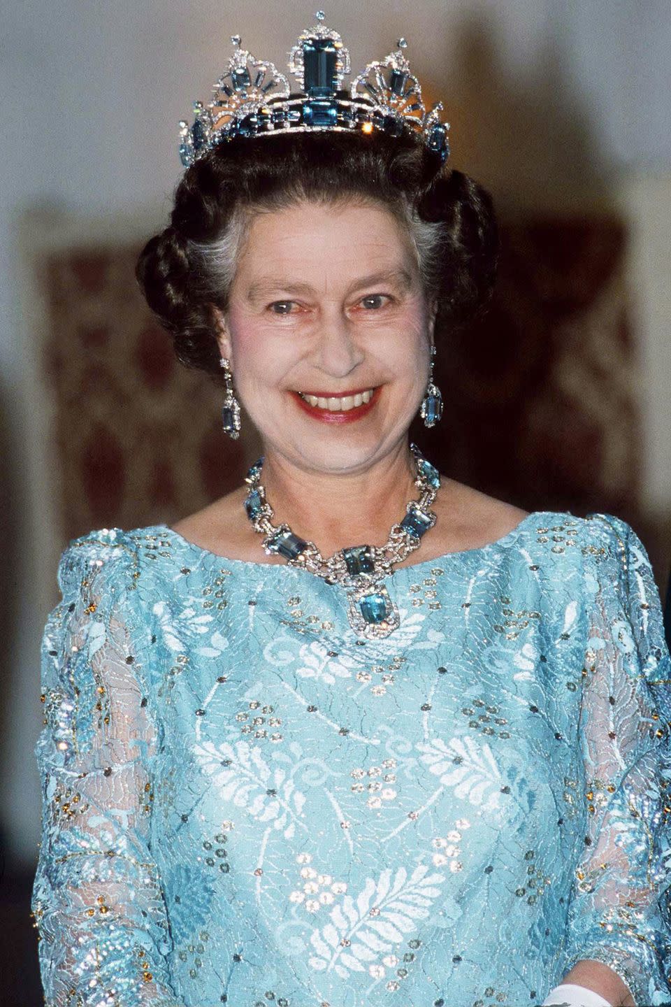 <p>This aquamarine and diamond necklace and earrings set was made by Mappin & Webb, and was given to the Queen in 1953 by the people and President of Brazil. She later had a matching tiara made by Garrard from an additional collection of Brazilian stones. It's rare in that it reflects the Queen's personal style–most of her other tiaras are heirlooms.<br></p>