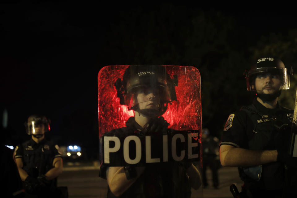 Metropolitan Police Department bicycle division officers stand guard after police closed the area around Lafayette Park near the White House after protesters tried to topple a statue of Andrew Jackson in the park in Washington, Monday, June 22, 2020. (AP Photo/Maya Alleruzzo)