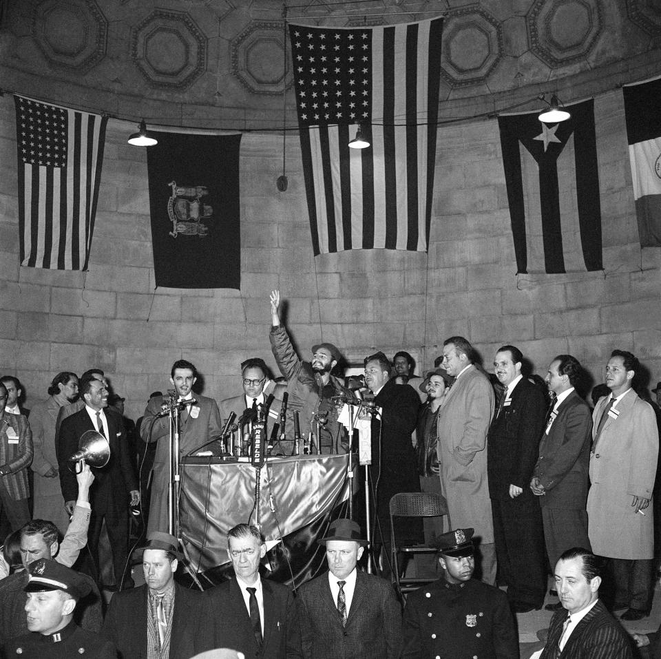 FILE - In this April 24, 1959, file photo, Cuban Prime Minister Fidel Castro waves to crowd in New York's Central Park. The sheen and spectacle of his first visit to New York City in 1959 gave away to subsequent visits as an effective enemy of the state railing from the U.N. podium at those he characterized as his country’s capitalist oppressors. (AP Photo/John Rooney, File)