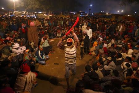 A butcher holding his blade takes part in the rituals before the sacrificial ceremony of the "Gadhimai Mela" festival held in Bariyapur November 28, 2014. REUTERS/Navesh Chitrakar