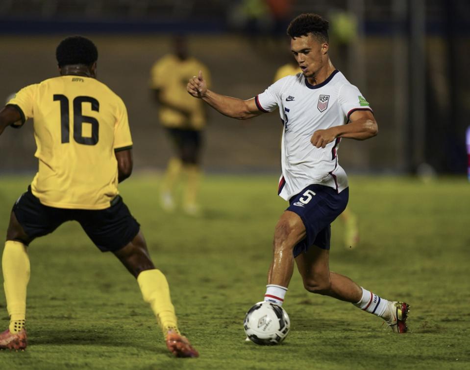 United States' Antonee Robinson dribbles the ball against Jamaica's Javain Brown.