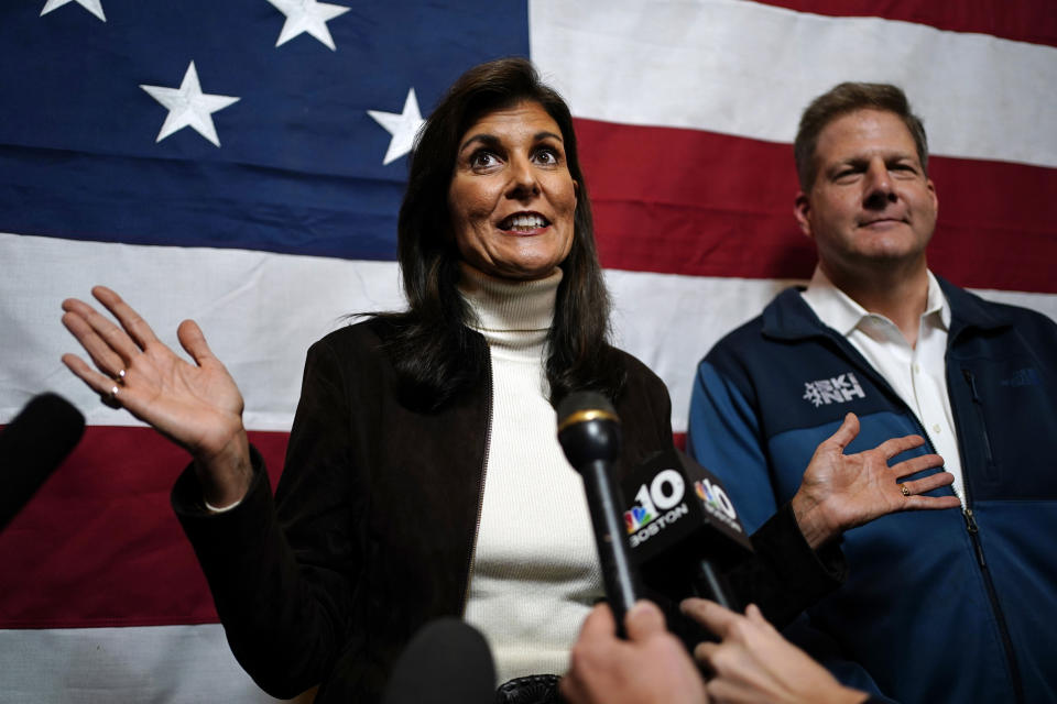 Republican presidential candidate former U.N. Ambassador Nikki Haley and Gov. Chris Sununu speaks to reporters following a town hall campaign event, Tuesday, Dec. 12, 2023, in Manchester, N.H. Haley received the New Hampshire governor's endorsement. (AP Photo/Robert F. Bukaty)