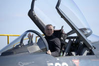 NATO Secretary-General Jens Stoltenberg sits on the cockpit of Japan's F-2 fighter jet of Japan's Air Self-Defense Force at Iruma Air Base in Sayama, northwest of Tokyo, Tuesday, Jan. 31, 2023. (AP Photo/Eugene Hoshiko)