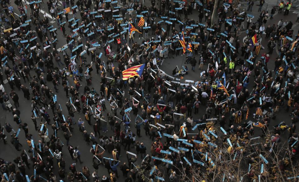 Catalan pro-independence demonstrators gather outside the Camp Nou stadium ahead of a Spanish La Liga soccer match between Barcelona and Real Madrid in Barcelona, Spain, Wednesday, Dec. 18, 2019. Thousands of Catalan separatists are planning to protest around and inside Barcelona's Camp Nou Stadium during Wednesday's match against fierce rival Real Madrid. (AP Photo/Joan Mateu)