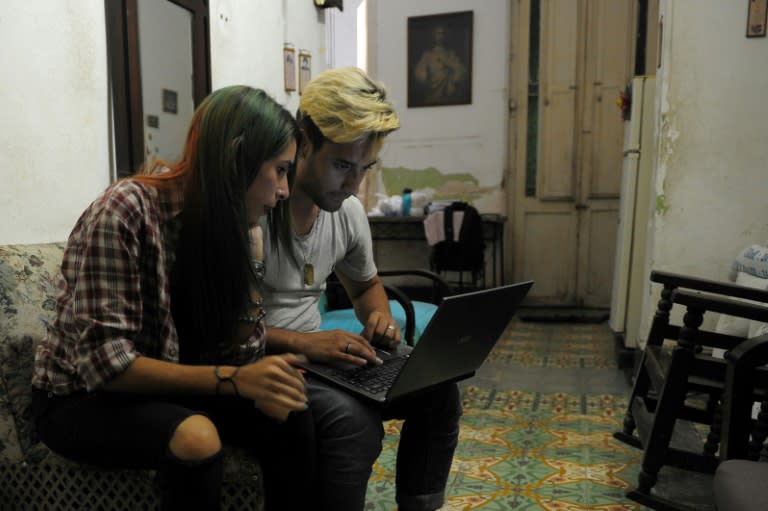 Cuban youtubers prepare videos at home in Havana, but posting them means a trek across town to a public square where there is wifi