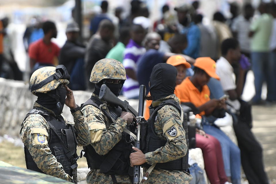 Security forces stand outside the National Pantheon Museum during a memorial ceremony for the late Haitian President Jovenel Moise in Port-au-Prince, Haiti, Tuesday, July 20, 2021. Moise was assassinated at home on July 7. (AP Photo/Matias Delacroix)