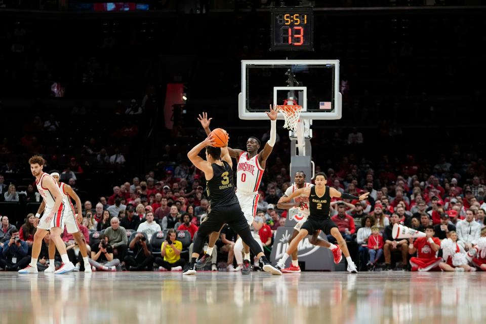 Nov 6, 2023; Columbus, OH, USA; Ohio State Buckeyes guard Scotty Middleton (0) defends Oakland Golden Grizzlies guard Jack Gohlke (3) during the first half of the NCAA men’s basketball game at Value City Arena.