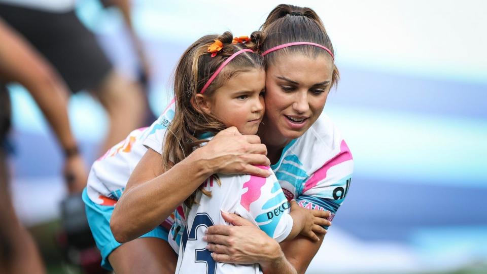 PHOTO: San Diego Wave FC forward Alex Morgan hugs her daughter Charlie Carrasco during a ceremony honoring Morgan before her final game on Sept. 8, 2024, in San Diego. (Meg Oliphant/Getty Images)