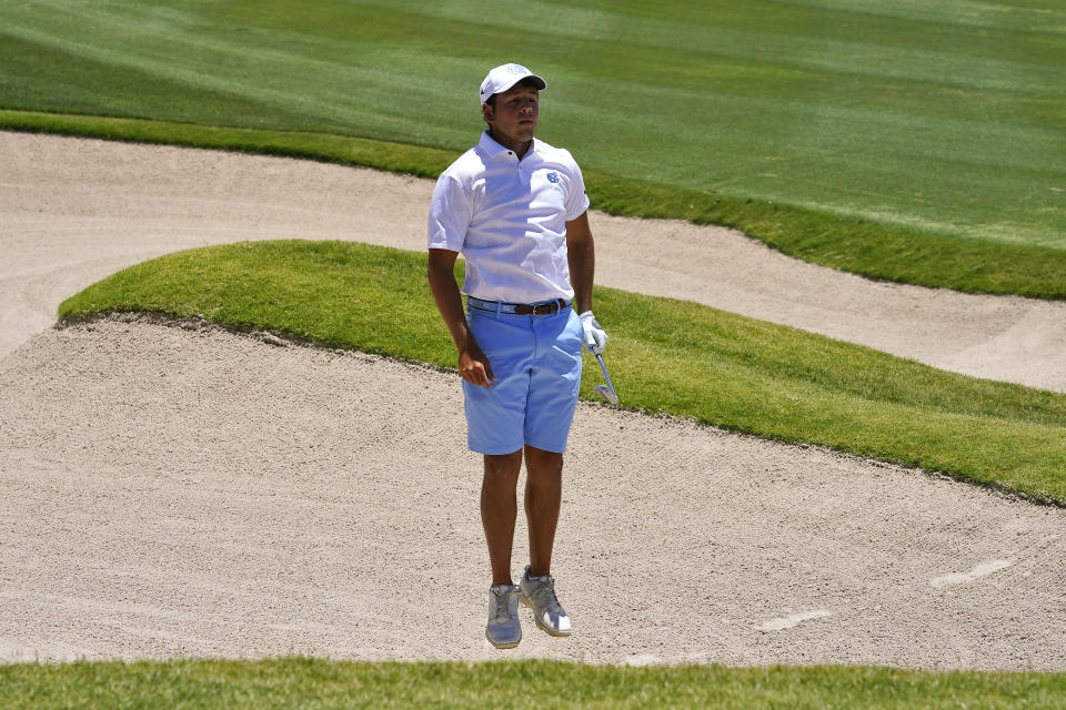 North Carolina golfer Dylan Menante jumps to see the green before hitting from the first fairway bunker during the final round of the NCAA college men's stroke play golf championship, Monday, May 29, 2023, in Scottsdale, Ariz. (AP Photo/Matt York)