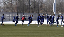 Members of the U.S. men's national soccer team run during practice in Columbus, Ohio, Wednesday, Jan. 26, 2022, ahead of Thursday's World Cup qualifying match against El Salvador. (AP Photo/Paul Vernon)