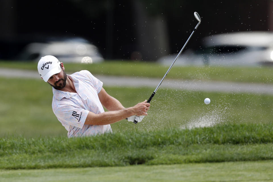 Wesley Bryan hits onto the 17th green drives during a nine-hole exhibition ahead of the Rocket Mortgage Classic golf tournament, Wednesday, July 1, 2020, at the Detroit Golf Club in Detroit. (AP Photo/Carlos Osorio)