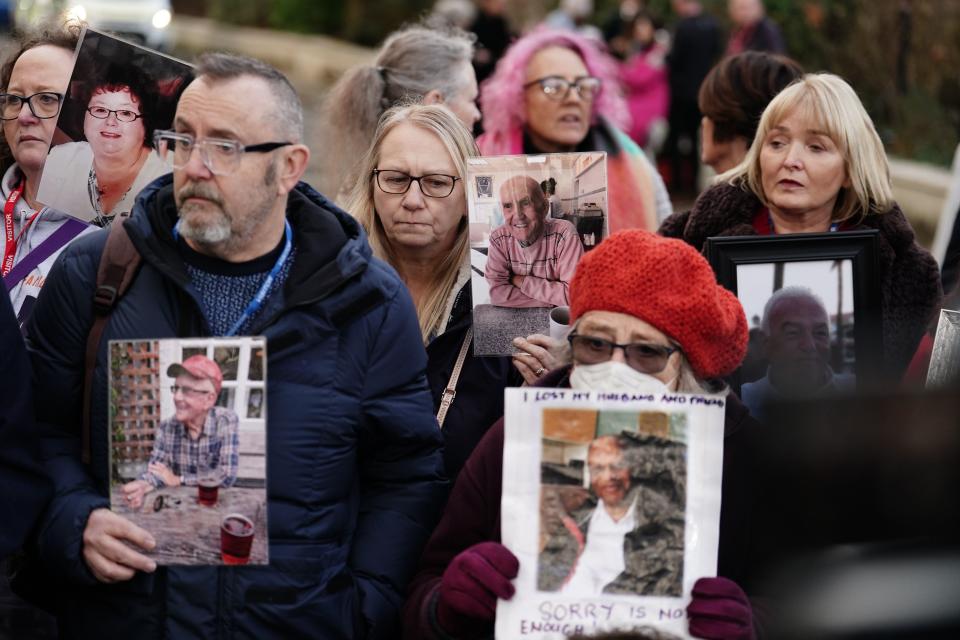 Members of Covid Bereaved Families, holding photographs of their relatives who died during the pandemic, outside Dorland House in London, where Prime Minister Rishi Sunak was giving evidence to the UK Covid-19 Inquiry (Jordan Pettitt/PA) (PA Wire)