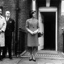 <p>Headed to lunch with Queen Elizabeth II, Jackie is photographed in London wearing a ladylike skirt, gloves, and jacket, adorned with a beautiful brooch.<br></p>