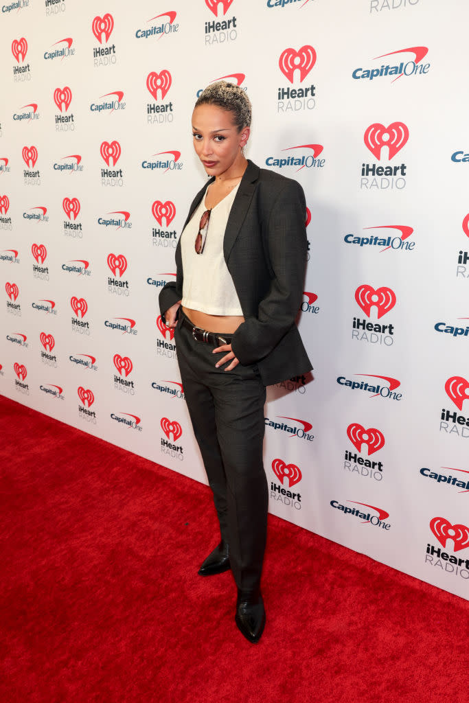 Doja Cat at the iHeartRadio Music Festival on Sept. 21 in Las Vegas, red carpet, gray suit