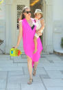 Celebrities in neon fashion: Khloe Kardashian covered up in a pink kaftan.<br><br>[Splash]