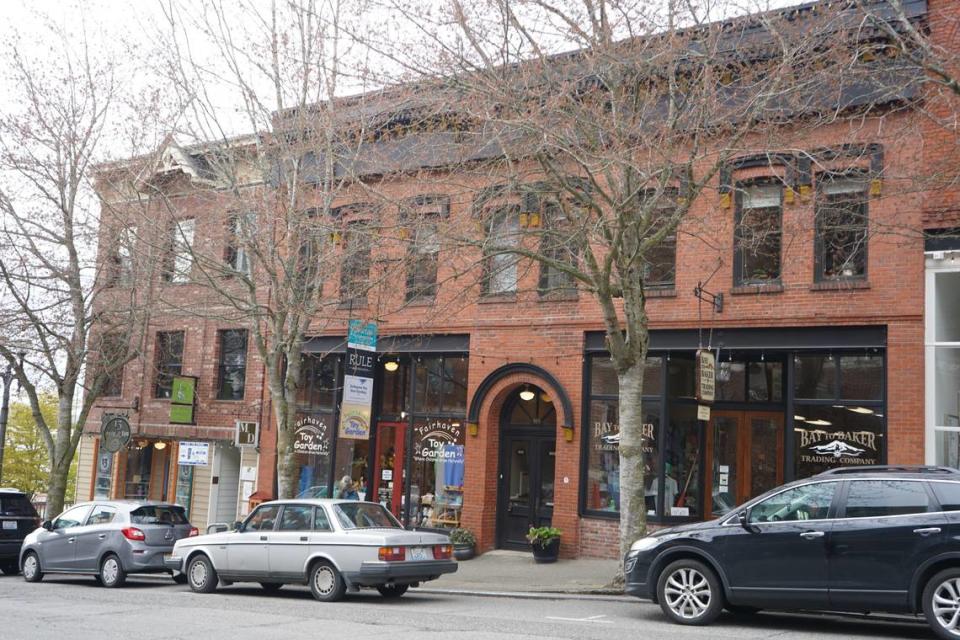 Cars are parked in front of 907-911 Harris Ave. on Thursday, April 20, in Bellingham. The two buildings were jointly listed for sale by the Muljat Group for $3,495,000.