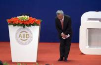 Jin Liqun, the first president of the Asian Infrastructure Investment Bank (AIIB), bows toward Chinese President Xi Jinping (not shown) after speaking during the opening ceremony of the AIIB in Beijing, China, January 16, 2016. REUTERS/Mark Schiefelbein/Pool