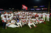 The Philadelphia Phillies pose after winning the baseball NL Championship Series against the San Diego Padres in Game 5 on Sunday, Oct. 23, 2022, in Philadelphia. (AP Photo/Matt Slocum)