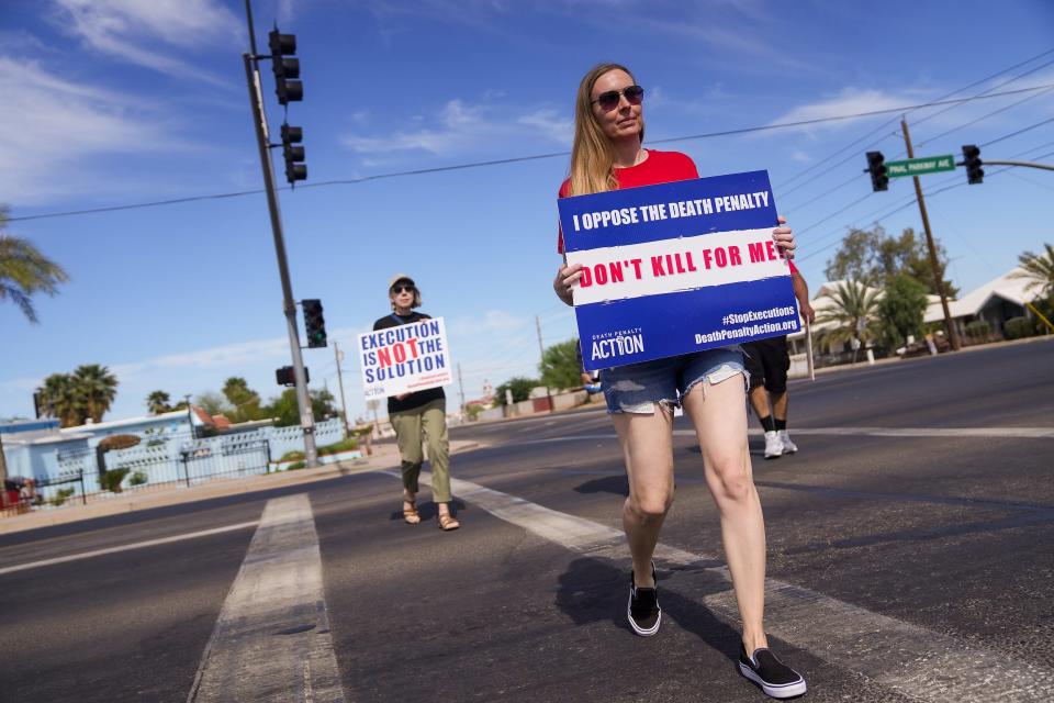 Jessica MacTurk protests the execution of Clarence Dixon outside the Arizona State Prison Complex on May 11, 2022, in Florence.