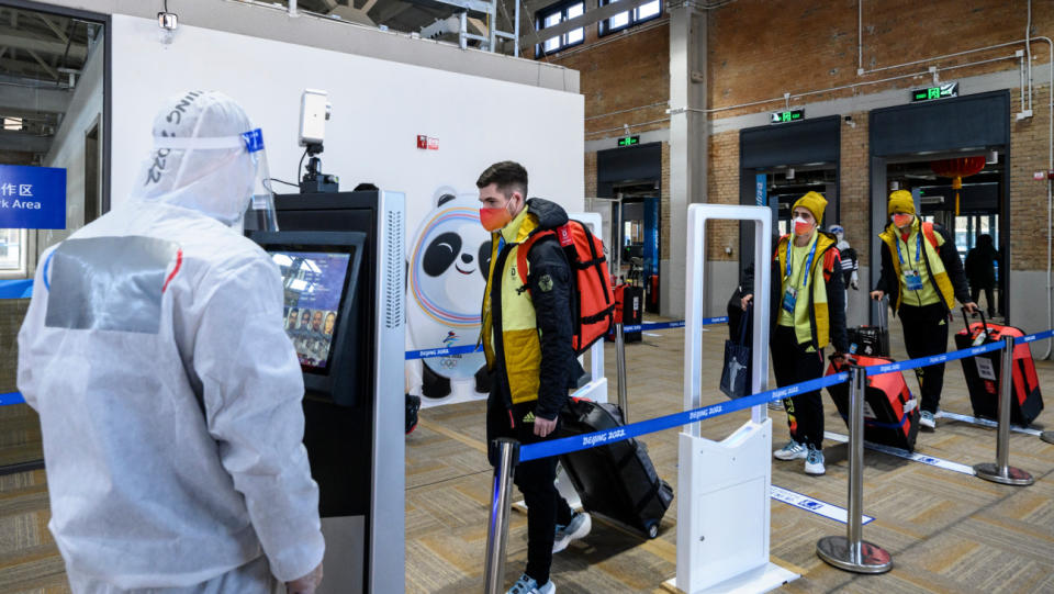 Members of Team Germany go through security after arriving at the Olympic Village ahead of the Beijing 2022 Winter Olympic Games on Feb. 1, 2022, in Beijing, China.