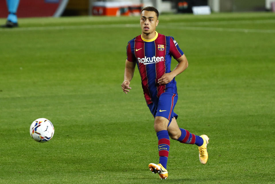 Sergiño Dest doesn't want to just be the first American player to appear for Barcelona's vaunted first team. (AP Photo/Joan Monfort)