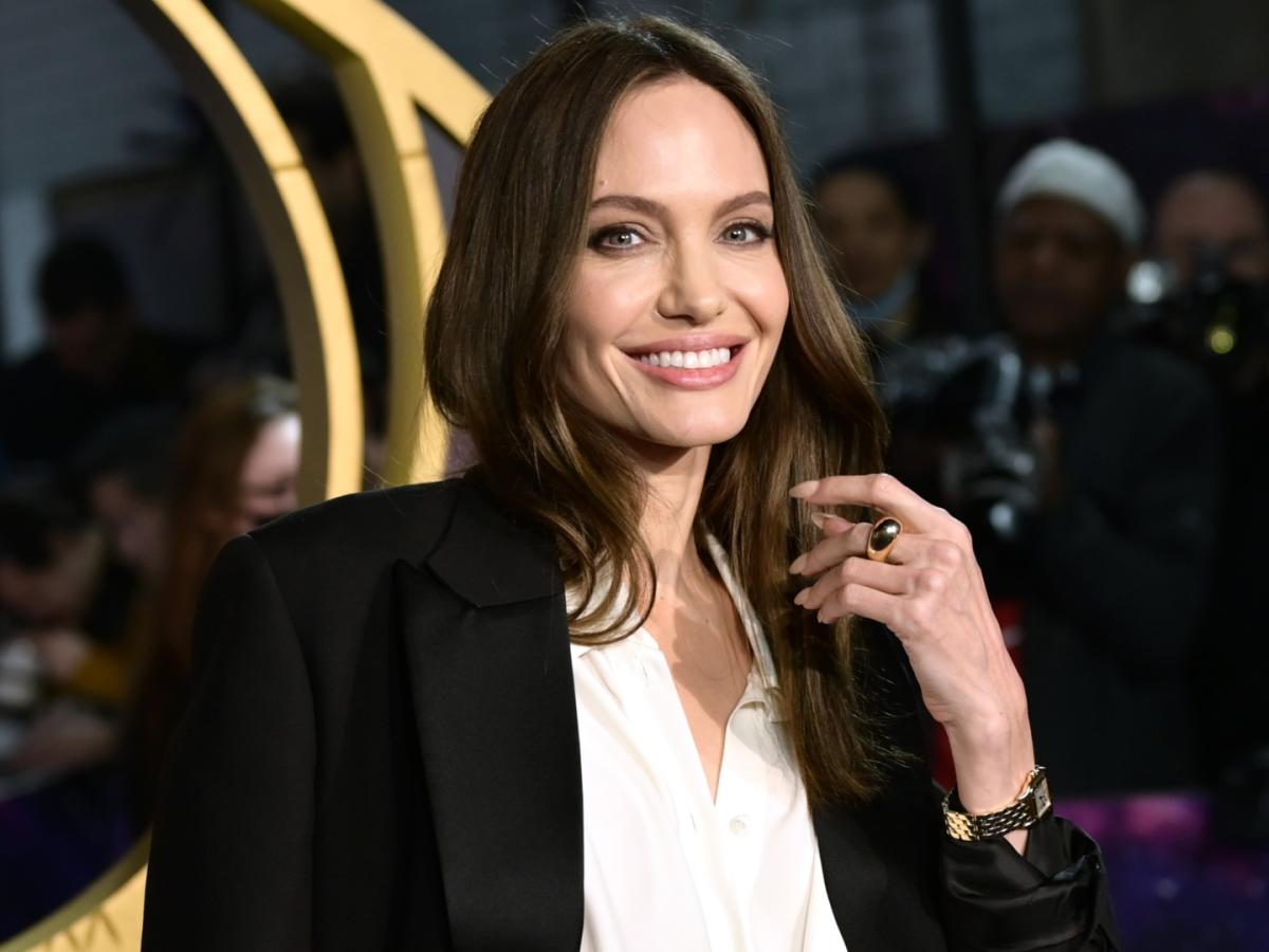 Angelina Jolie debuts middle finger tattoos with mystery message – NBC  Boston