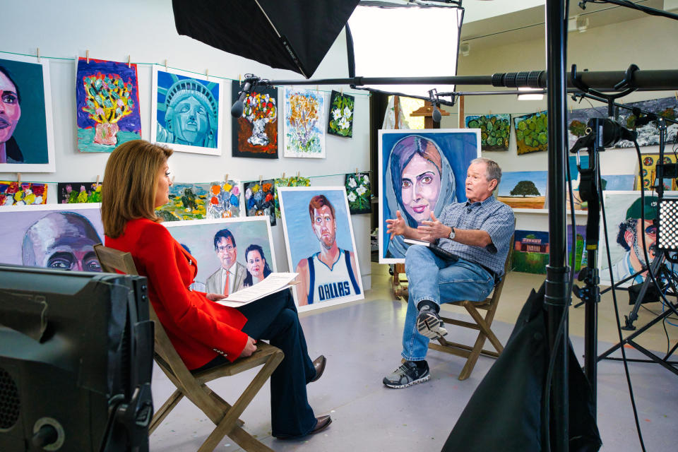 Former President George W. Bush talks with 