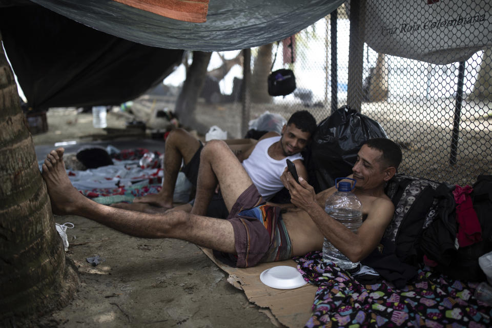 Migrants camp on the beach in Necocli, Colombia, waiting to board a boat to cross the Uraba Gulf and walk across the Darien Gap to Panama, on Sunday, May 7, 2023. (AP Photo/Ivan Valencia)
