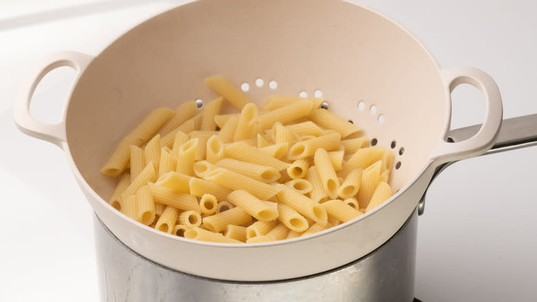 cooked pasta in a colander 