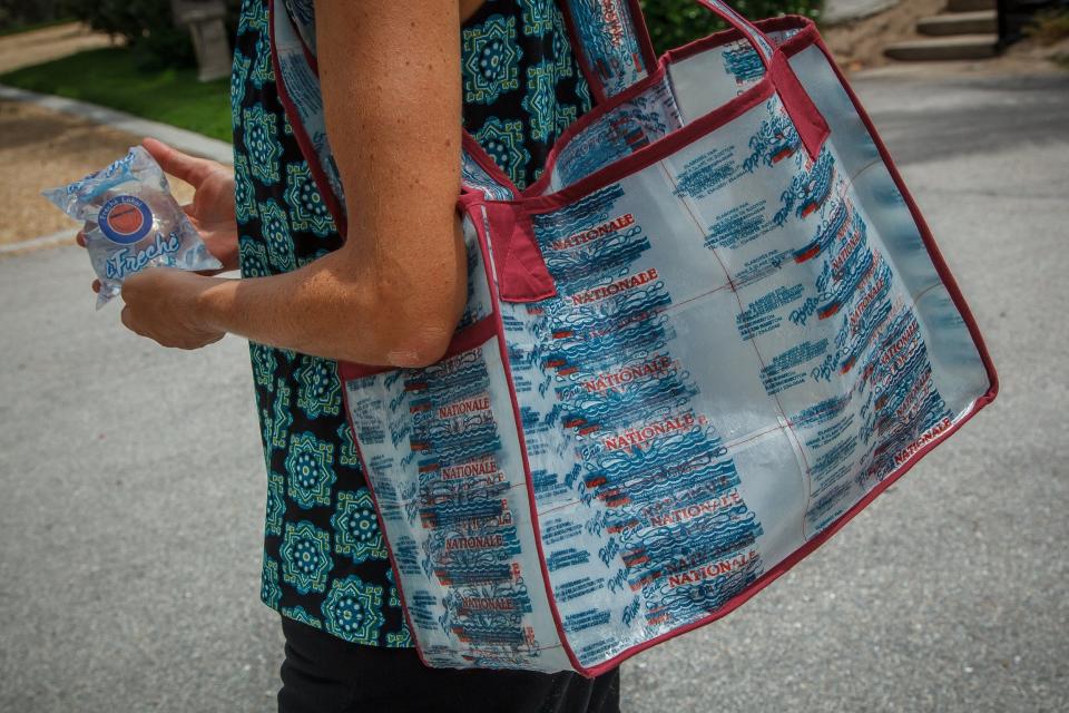 An example of a Haitian water sachet photographed on Wednesday, August 4, 2021. Similar to a water bottle, the sachet is bitten to create a hole to consume the clean water within. The small plastic bags litter the Haitian landscape and others have drifted in the ocean to land land on Palm Beach County shores. Rose Heimann's company PeaceCYCLE repurposes Haitian waste into bags, wallets and other products. Heimann's company creates jobs for workers in Haiti.