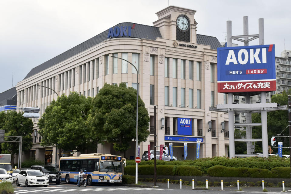 This photo shows the headquarters of Aoki Holdings Inc., a clothing company, in Yokohama, near Tokyo Wednesday, Aug. 17, 2022. A former Tokyo Olympic organizing committee board member and three people from the clothing company that was a surprise sponsor of the 2020 Games were arrested on bribery suspicions Wednesday. (Kyodo News via AP)