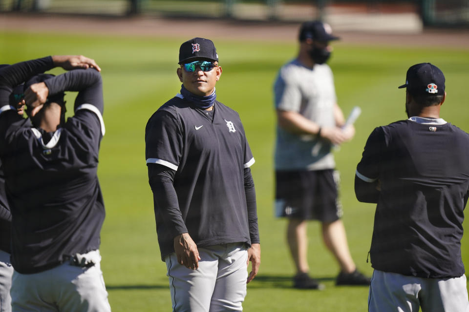 Detroit Tigers' Miguel Cabrera stands on the field with teammates during a spring training baseball workout Friday, Feb. 26, 2021, in Lakeland, Fla. (AP Photo/Frank Franklin II)