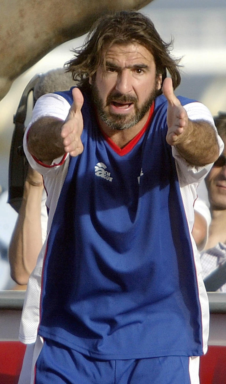 French soccer player Eric Cantona reacts during the third place match of the  Euro Beach Soccer cup in Lisbon, Portugal on Tuesday, June 29, 2004. France lost to Italy after a penalty shoot out 9 :10. (AP Photo/Markus Schreiber)