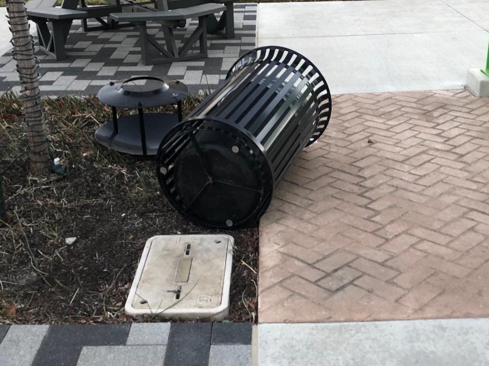 A trash bin in downtown Topeka's Evergy Plaza was ripped from its bolted-down foundation during Wednesday's high winds.