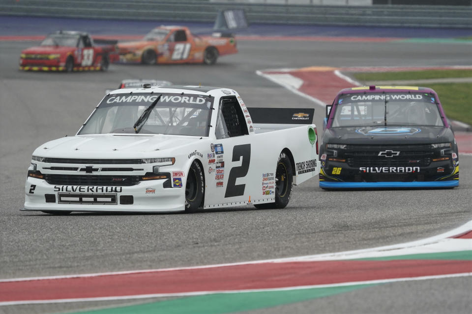 Sheldon Creed (2) leads Tyler Ankrum (26) into Turn 13 during the NASCAR Truck Series auto race at the Circuit of the Americas in Austin, Texas, Saturday, May 22, 2021. (AP Photo/Chuck Burton)