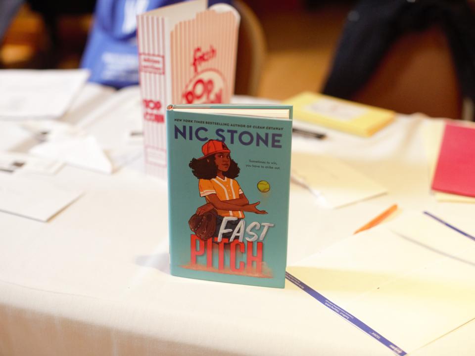 New York Times best-selling Author Nic Stone's book, Fast Pitch, was proudly on display at the Peace and Freedom Committee's MLK Breakfast Monday.