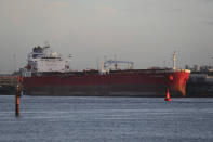 The Nave Andromeda oil tanker is docked next to the Queen Elizabeth II Cruise Terminal in Southampton, England, Monday, Oct. 26, 2020. The U.K. military seized control of the oil tanker that dropped anchor in the English Channel after reporting it had seven stowaways on board who had become violent. (Andrew Matthews/PA Wire via AP)