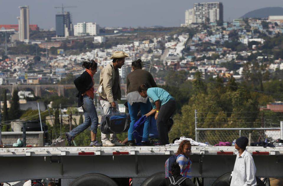 Central American migrants arrive in Queretaro, Mexico, as they resume their journey north after leaving the temporary shelter in Mexico City, Saturday, Nov. 10, 2018. Thousands of Central American migrants were back on the move toward the U.S. border Saturday, after dedicated Mexico City metro trains whisked them to the outskirts of the capital and drivers began offering rides north. (AP Photo/Marco Ugarte)