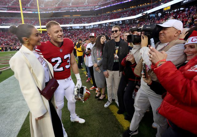 <p>Jane Tyska/Digital First Media/East Bay Times via Getty</p> Olivia Culpo and Christian McCaffrey greet fans before the 49ers' game against the Baltimore Ravens in December 2023