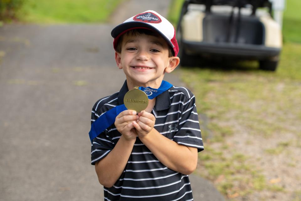 Charlie Vilardi, a 6-year-old from Hopewell Junction, poses with his medal after winning a U.S. Kids Golf tournament in Connecticut.